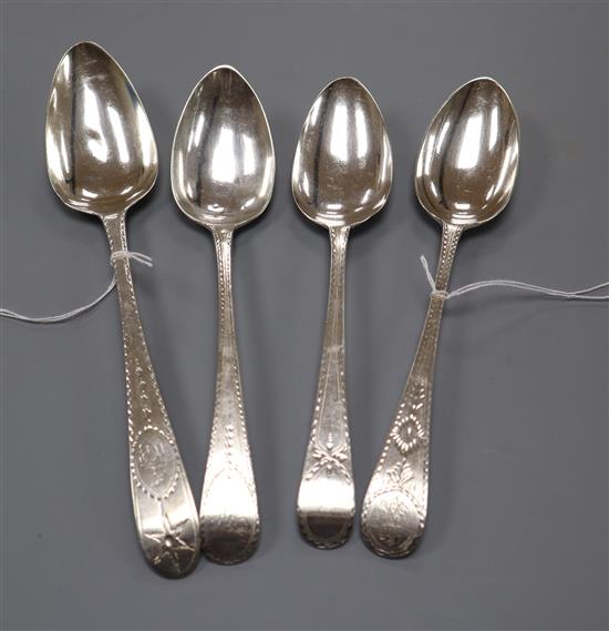 An Irish George III silver bright-cut tablespoon, John Power, Dublin 1802 and three other George III bright-cut spoons,